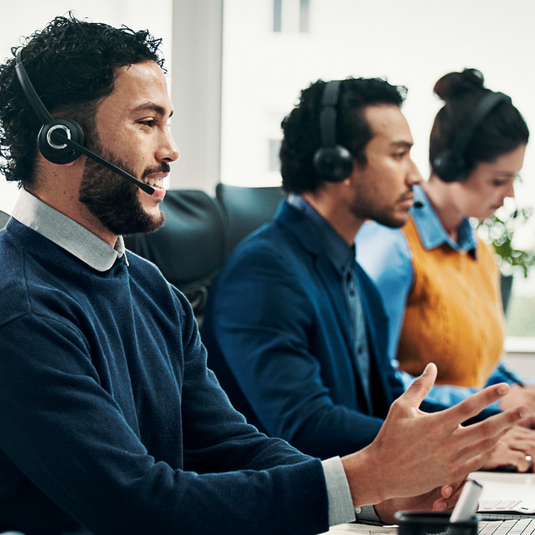 Man with headset, phone, receptionist